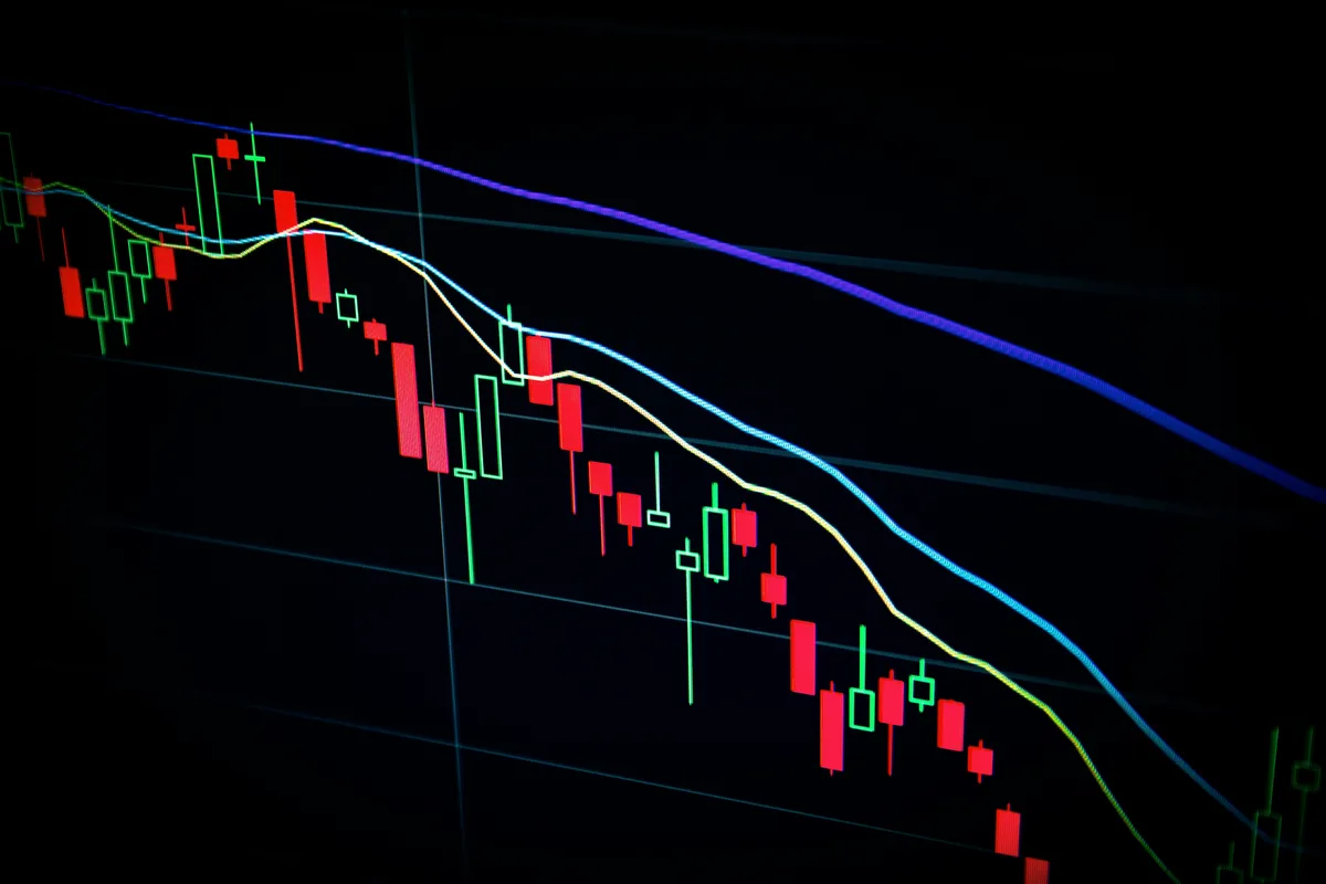 Long-term capital gains rates 2026 — stock market candlestick chart on screen